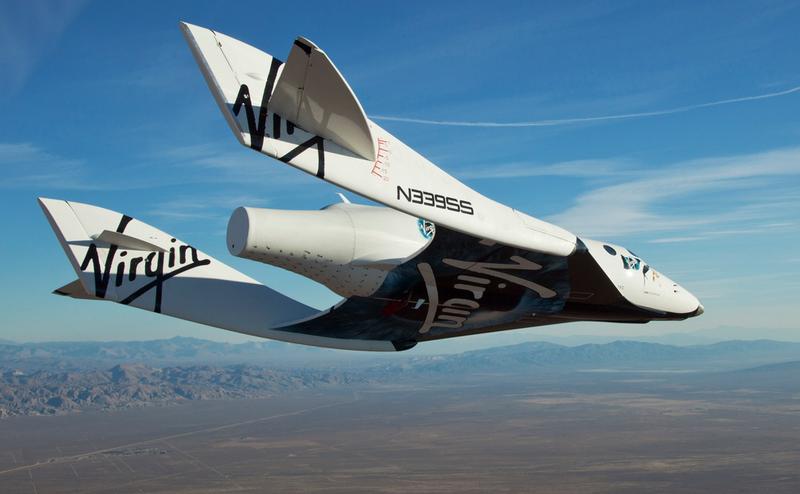 The Virgin Galactic SpaceShip2 (VSS Enterprise) glides toward earth on its first test flight after release from the mothership, "WhiteKnight2" over the Mojave, Ca. area early Sunday October 10, 2010