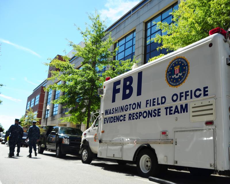 In this handout image provided by the U.S. Navy, An F.B.I. evidence response team collects evidence on September 18, 2013 at Building 197 at the Washington Navy Yard in Washington, DC.