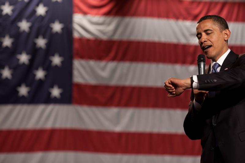 President Obama checks his watch during a town hall meeting for health care reform in Green Bay, Wisconsin.