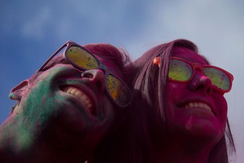 Revelers pose for a photo during the Holi Run on October 19, 2014 in Madrid, Spain. Around 20,000 people attended the 5K race without winners where participants are showered with colored powders.