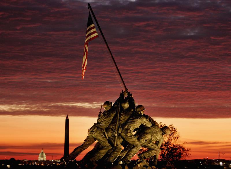 The early morning sun begins to rise behind the Iwo Jima Memorial on November 11, 2004 in Arlington, Virginia.