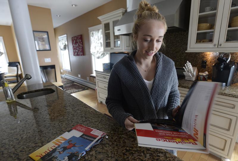 Gabriella Latini opens her acceptance letter from the University of Tampa Tuesday, March 17, 2015.