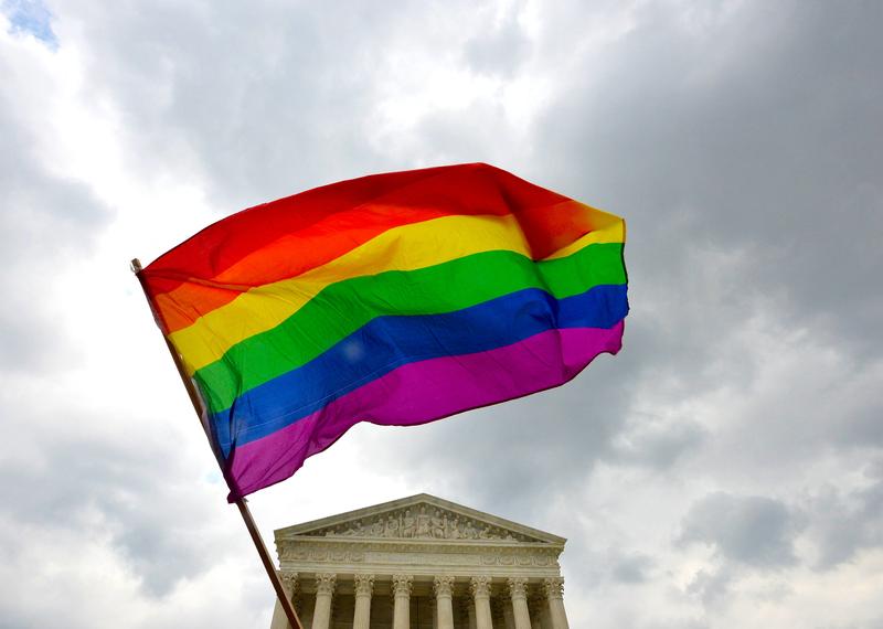 The multicolored flag of the gay rights movement is seen outside the Supreme Court in Washington, DC on June 26. 2015 after its historic decision on gay marriage.