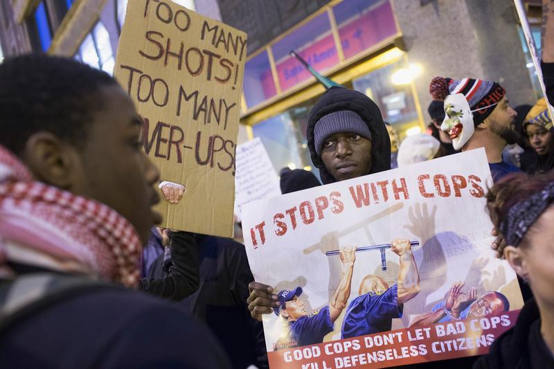 Demonstrators march through downtown on December 12, 2015 in Chicago, Illinois.