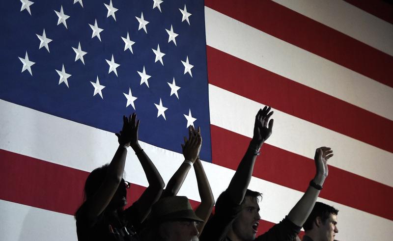 Supporters of Democratic presidential candidate Hillary Clinton cheer as the results of the polls are announced during a campaign event on Super Tuesday in Miami on March 1, 2016.