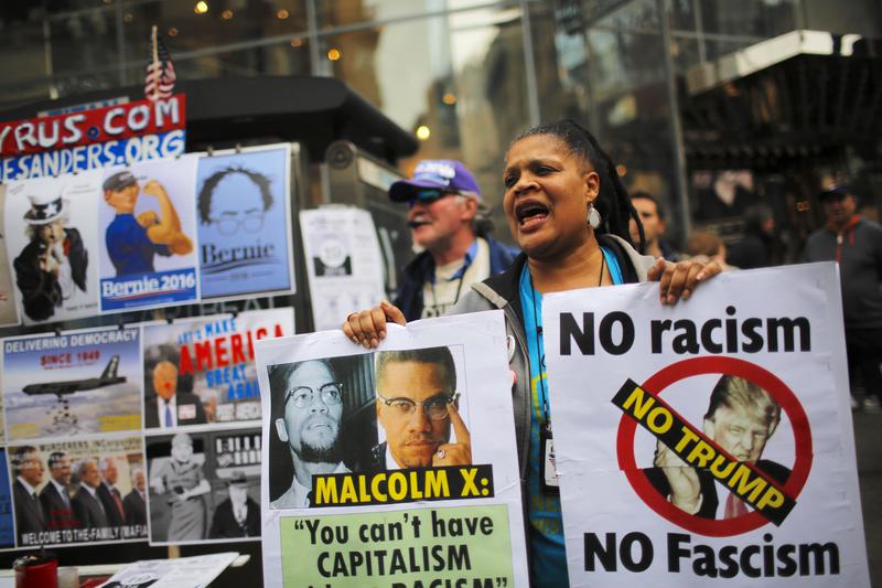 A woman shouts slogans as peace activists take part in a rally and march protesting Donald Trump and war on March 13, 2016 in New York City.