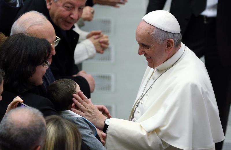 Pope Francis meets with Vatican employees and their families at the Paul VI Hall on December 22, 2014 in Vatican City, Vatican.