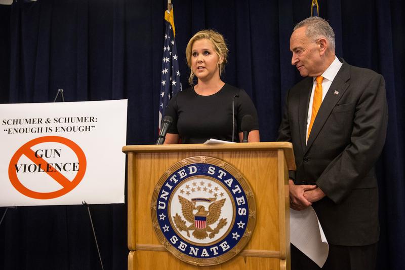 Comedian Amy Schumer (L) and U.S. Senator Chuck Schumer (D-NY) speak at a press conference calling for tighter gun laws in an effort to stop mass shootings and gun violence on August 3, 2015 in NYC.
