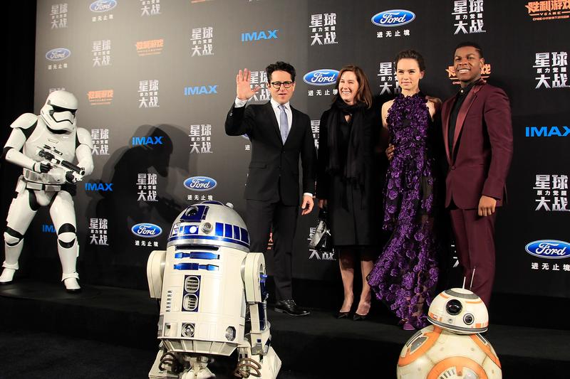 From left to right, J.J. Abrams, Kathleen Kennedy, Daisy Ridley, John Boyega, attend the premiere of Star Wars on December 27, 2015 in Shanghai, China.