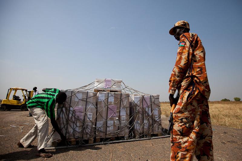 UN workers unload ballot papers printed in Britain for the upcoming independence referendum on South Sudan upon arrival on a plane at Juba airport on December 22, 2010.