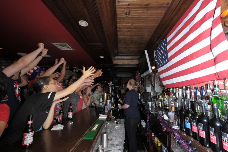 USA soccer fans react while watching the televised 2010 FIFA World Cup South Africa match between USA and Ghana at Jack Demsey's bar on June 26, 2010 in New York City.