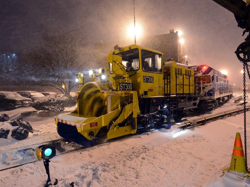 A NYC transit snow thrower, moving into position