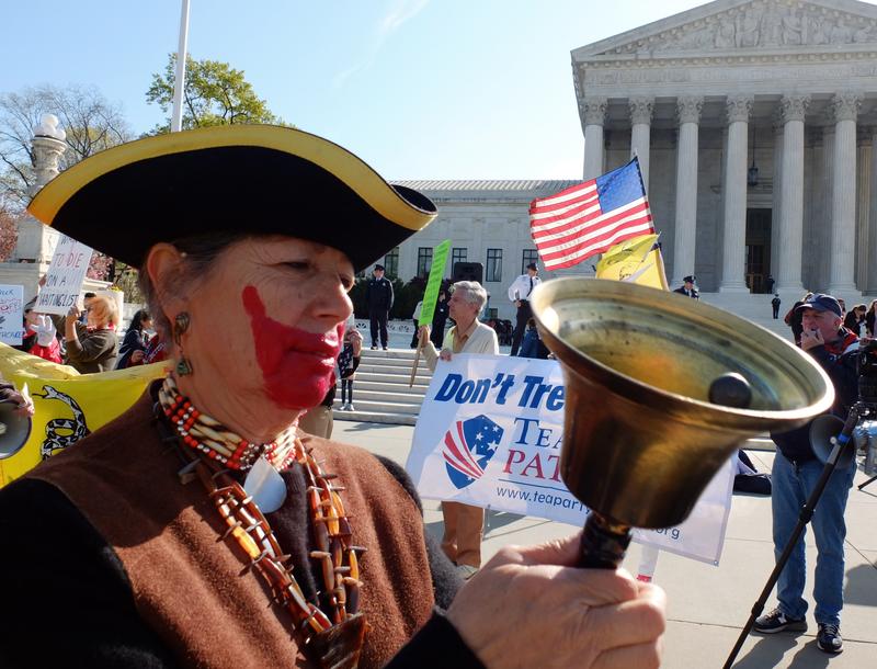 A tea-party supporter protest outside the US Supreme Court on the third day of oral arguements over the constitutionality of the Patient Protection and Affordable Care Act