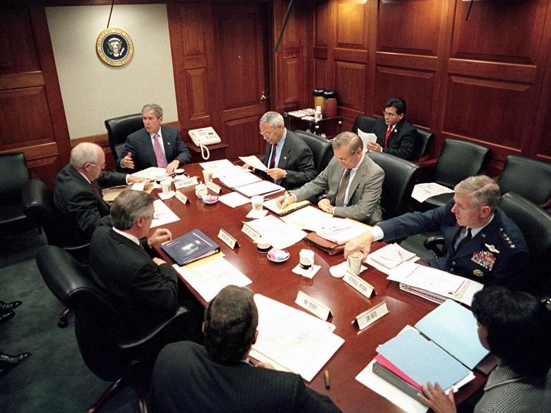 President George W Bush meets with top security and government officials in the White House Situation Room, during the aftermath following the September 11th, 2001 terrorist attacks.