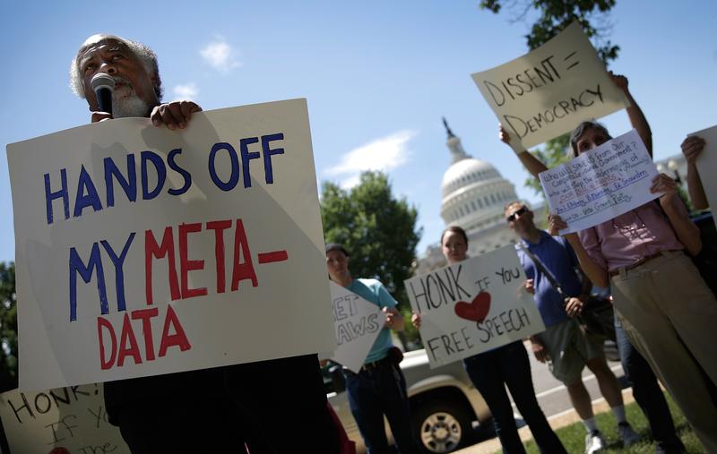 Protesters rallying outside the U.S. Capitol against the NSA's detailed surveillance programs in June of 2013.