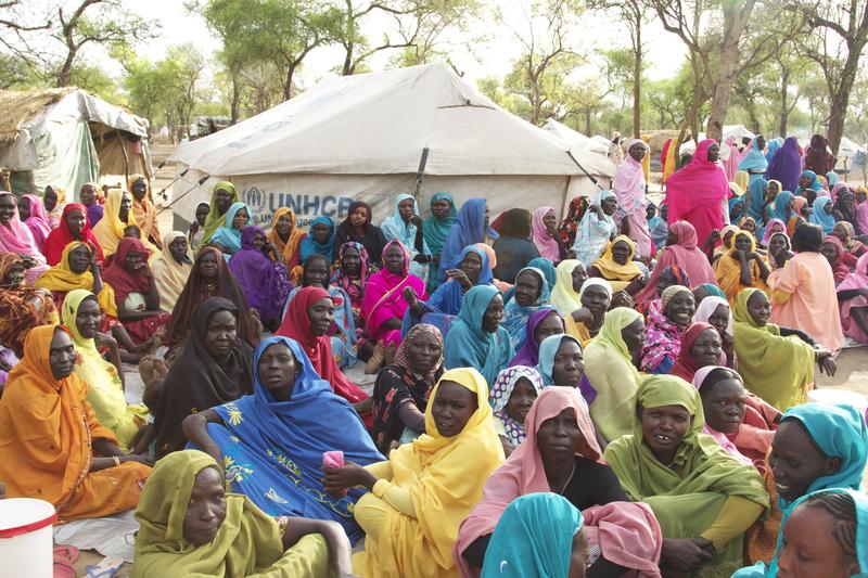 Women gather in a refugee camp.