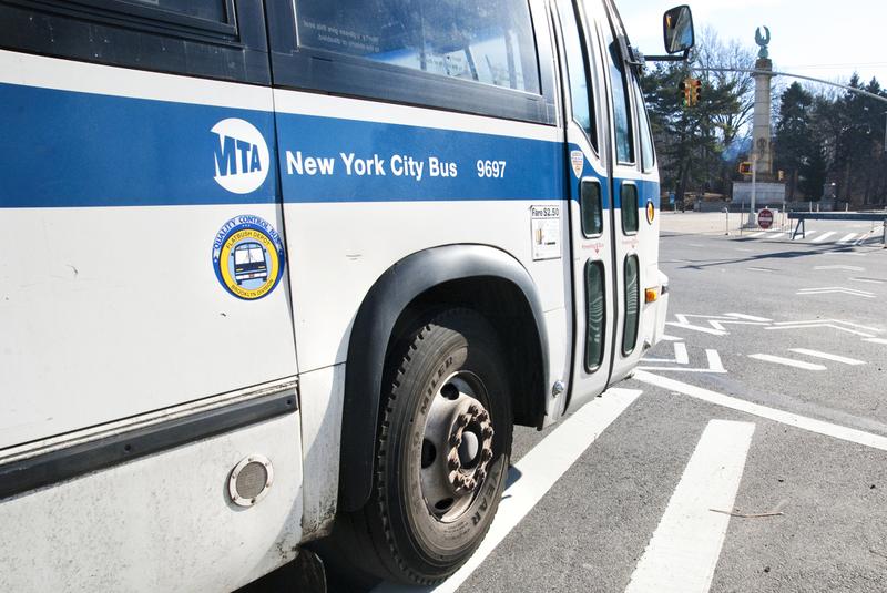 A New York City bus turns a corner in Brooklyn.