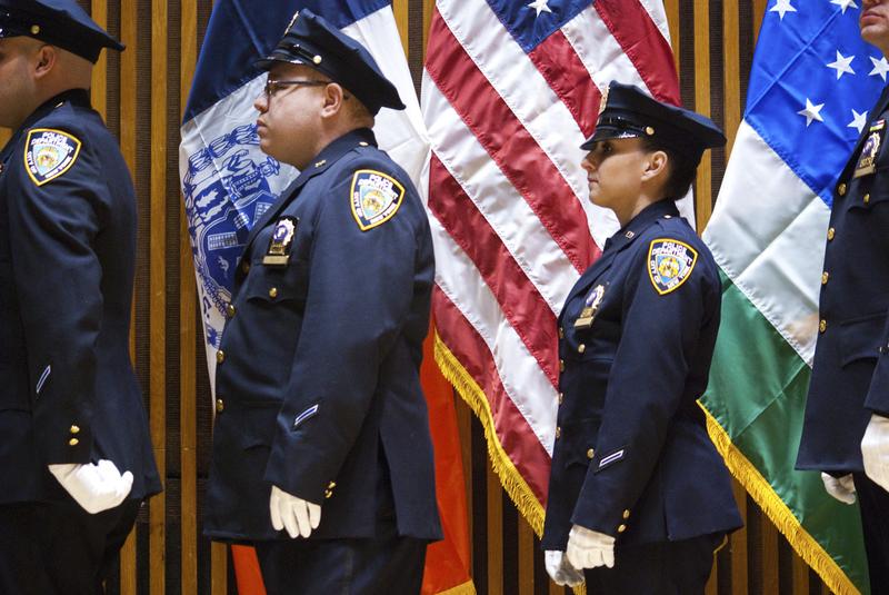 NYPD officers wait in line during a ceremony at One Police Plaza.