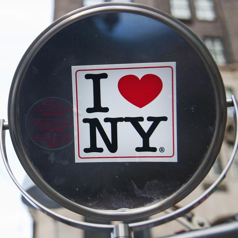 An "I heart NY" sticker on a vendor's mirror near Central Park.
