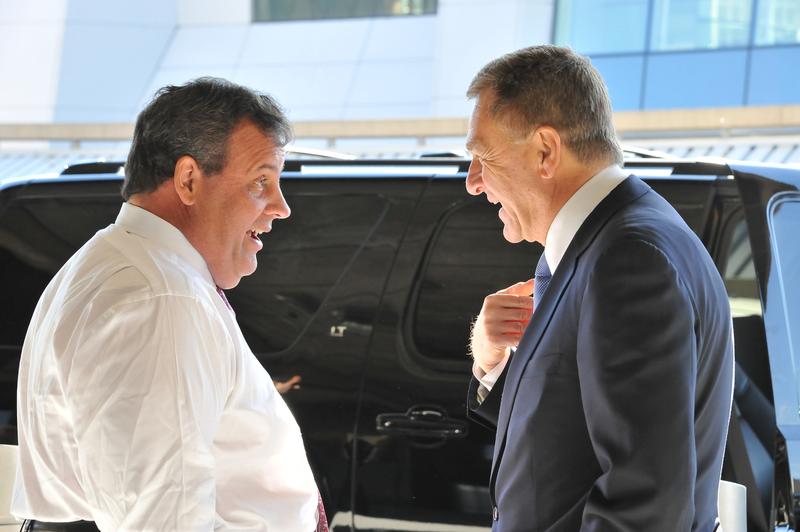 Governor Chris Christie, left, and David Samson, a former Port Authority chairman, have a conversation after a press conference at the Newark Liberty International Airport.