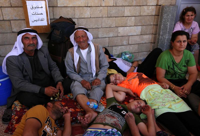 Iraqi Christians who fled the violence in the village of Qaraqush, about 30 kilometres east of the northern province of Nineveh.
