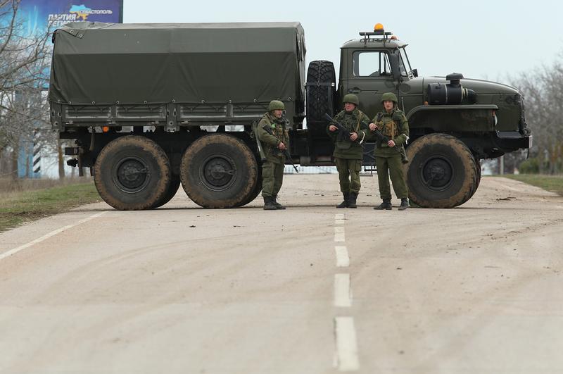 A truck and soldiers block the road leading to Babek Airport near Sevastopol that is occupied by Russian troops in Crimea on March 2, 2014 near Balbek, Ukraine.
