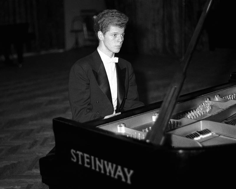 This April 11, 1958 file photo shows pianist Van Cliburn performing in final round of Tchaikovsky International Piano & Violin competition in Moscow.