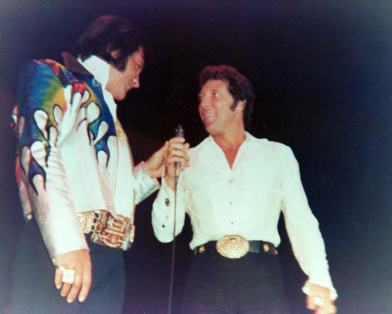 Tom Jones in a belt buckle competition with Elvis.