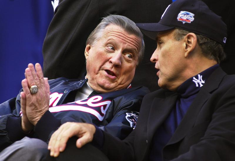 New York City Mayor Rudy Giuliani, right, talks with New York Yankees owner George Steinbrenner October 30, 2000 after the Yankees'' victory parade in New York City.