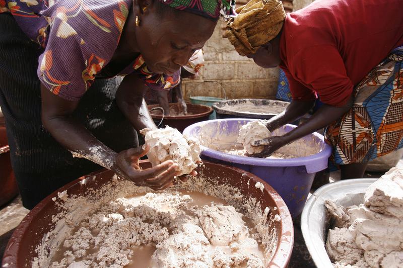 Women from a cooperative in Ouagadougou, Burkina Faso prepare butter for use in cosmetics exporter to Europe and the United States.