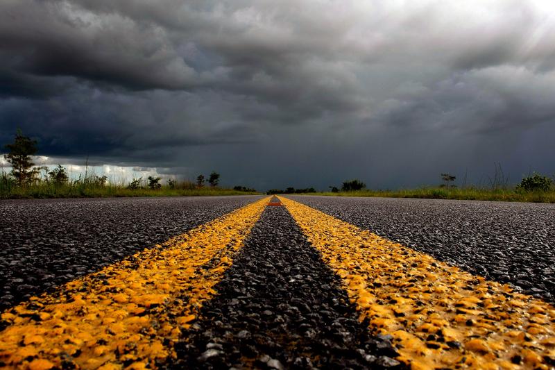 Rain clouds move over a road in the Florida Everglades September 12, 2007 in the Everglades National Park, Florida.