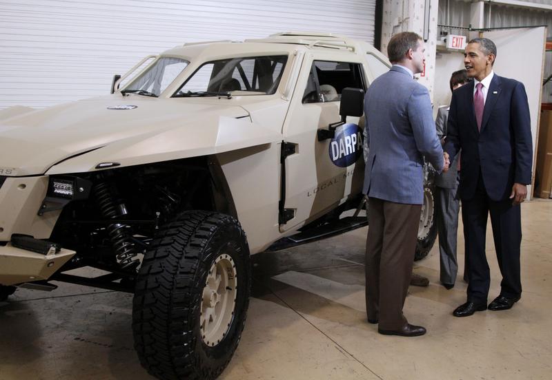 Former President Barack Obama is shown the DARPA Car as he tours Carnegie Mellon University in June 2011.