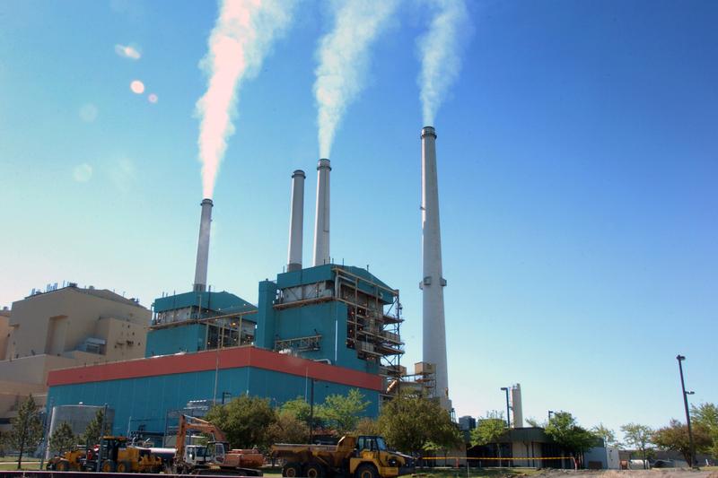 In this July 1, 2013, file photo, smoke rises from the Colstrip Steam Electric Station, a coal burning power plant in Colstrip, Mont.