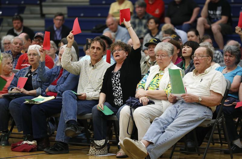 Audience members react as Rod Blum, R-Iowa, speaks during a town hall meeting on Thursday, May 11, 2017, in Marshalltown, Iowa.