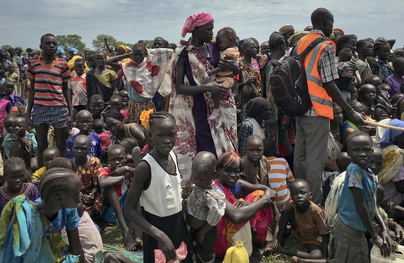 People line up to be registered with the World Food Programme (WFP) for food distribution in Old Fangak, in Jonglei state, South Sudan.