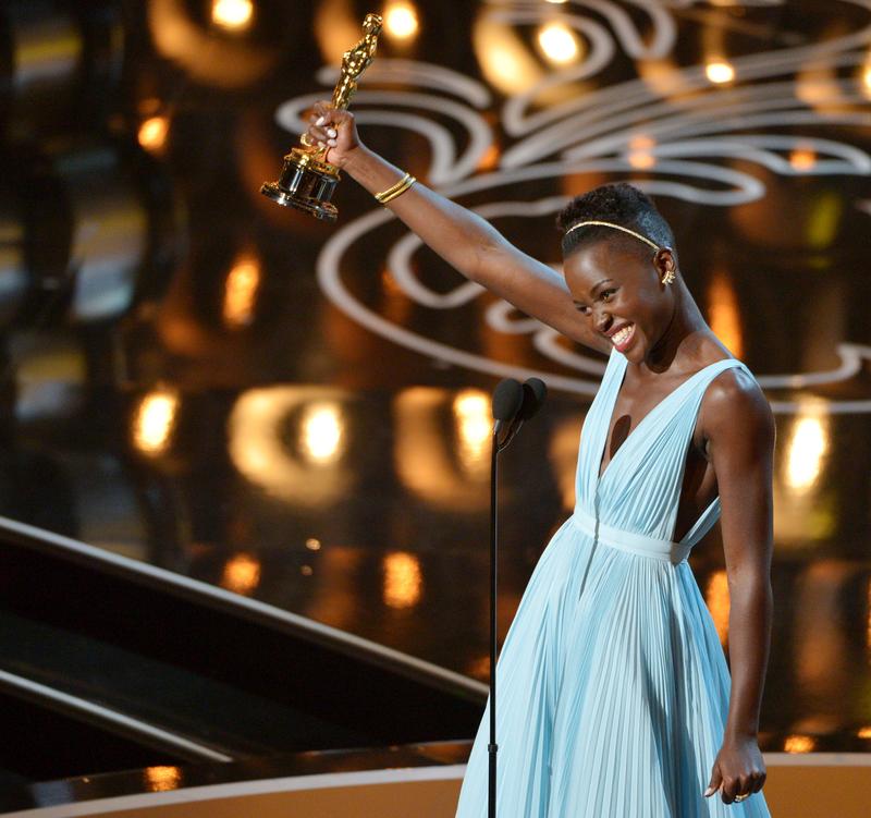 In this March 2, 2014 file photo, Lupita Nyong’o accepts the award for best actress in a supporting role for "12 Years a Slave" during the Oscars in Los Angeles.