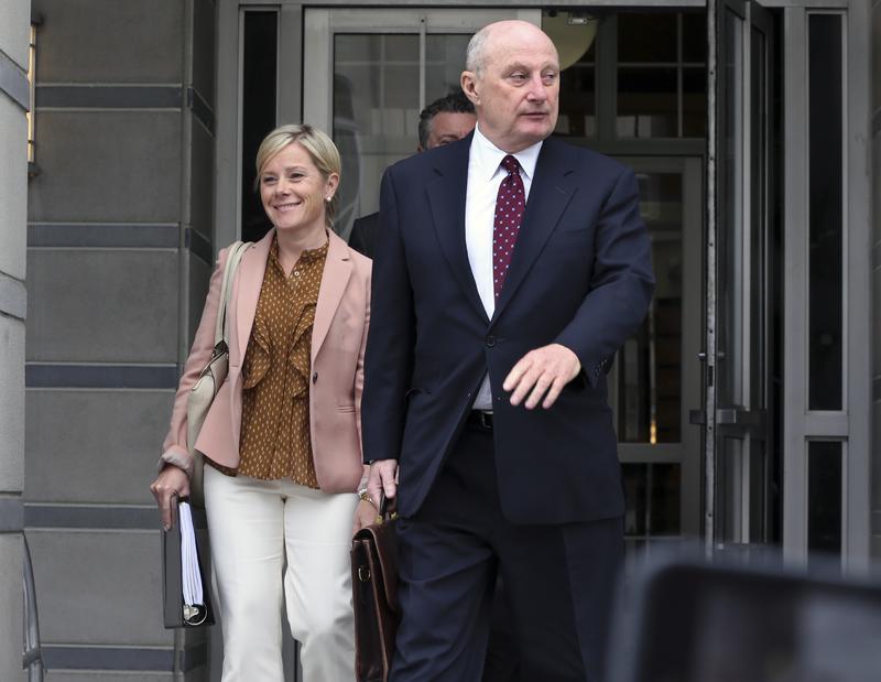 Attorney Michael Critchley accompanies his client, Bridget Anne Kelly, out of federal court in September.