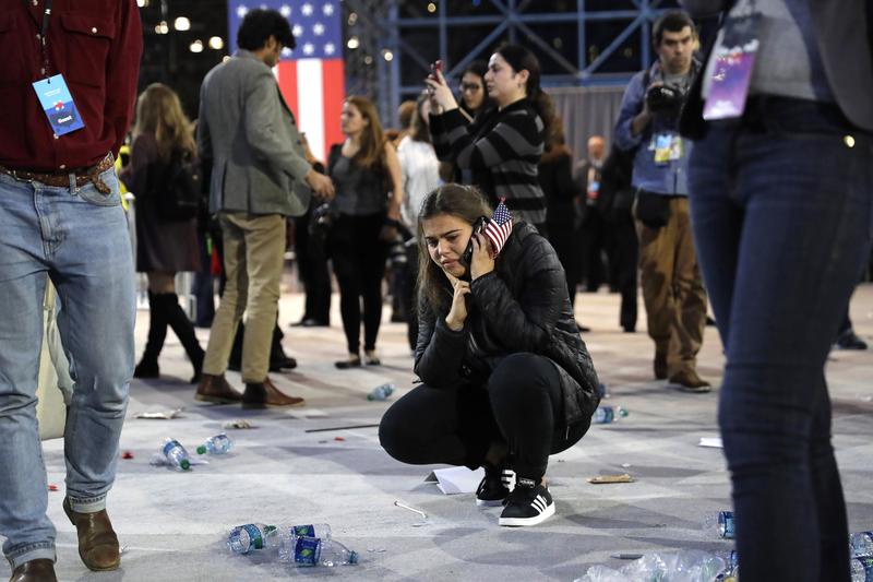 A Clinton supporter kneels alone after Democratic presidential nominee Hillary Clinton's election night rally was canceled at the Jacob Javits Center, New York, Nov 9, 2016