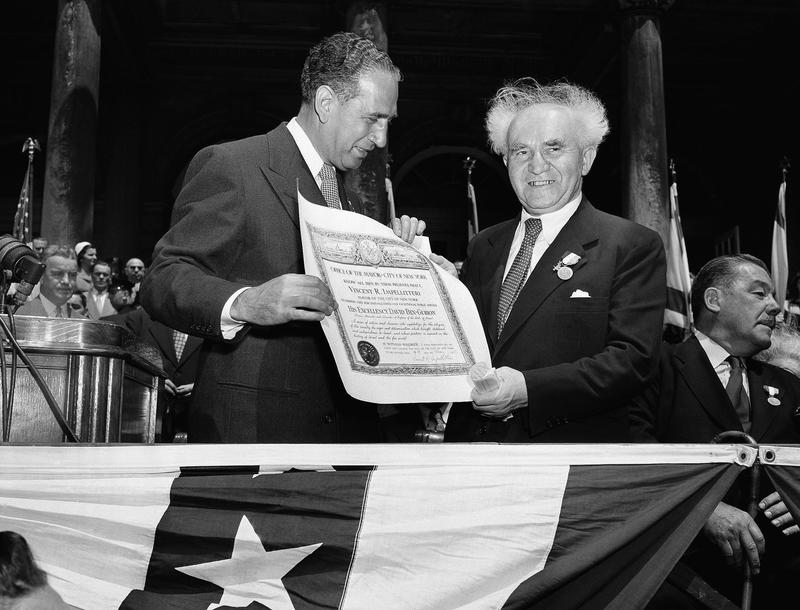 Premier David Ben-Gurion, right, of Israel smiles as he poses with a scroll of the city after it was presented to him by Mayor Vincent Impellitteri during ceremonies at New York's City Hall, 1951.
