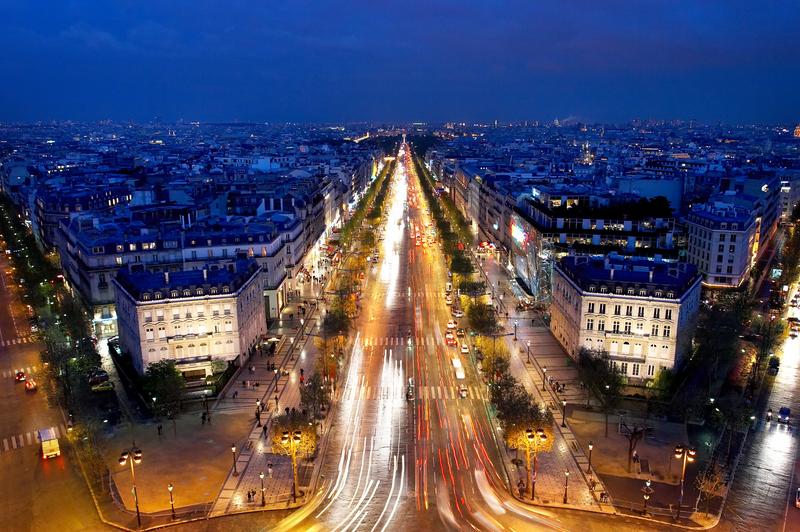 The Champs-Elysées in Paris at night.