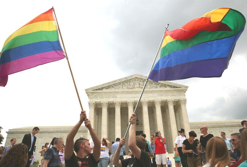 People celebrate in front of the U.S. Supreme Court after the ruling in favor of same-sex marriage June 26, 2015 in Washington, DC.