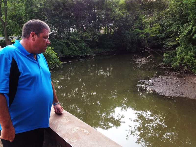 Hillsdale Fire Department Captain Tom Kelley looks out on the Pascack Brook, a source of regular flooding in his community