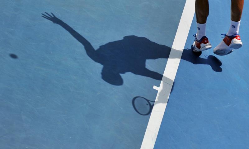 Novak Djokovic of Serbia serves against Nicolas Mahut of France in their third round men's singles match on day six of the 2012 Australian Open tennis tournament in Melbourne on January 21, 2012.