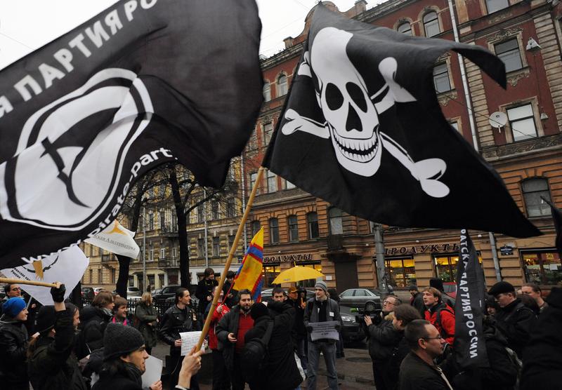 Members and supporters of anti-copyright Pirate Party take part in a rally against what they call the censorship in the Internet in Saint-Petersburg, on November 17, 2012.