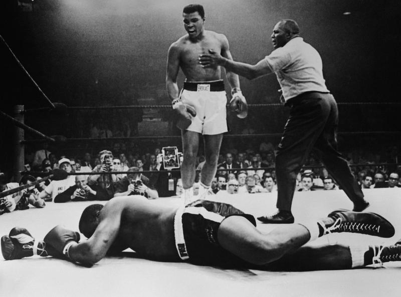 Sonny Liston lies out for the count after being KO'd in the first round of his return title fight by world heavyweight champion Muhammad Ali, Lewiston, Maine, May 25, 1965.