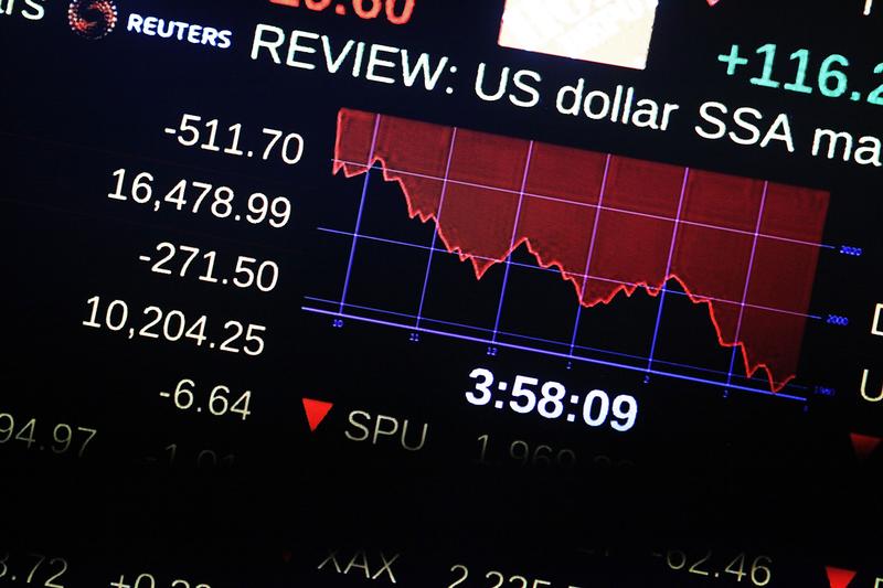 A screen on the floor of the New York Stock Exchange (NYSE) shows the market numbers near the close of the day on August 21, 2015 in New York City.