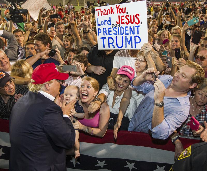 Republican presidential candidate Donald Trump greets supporters after his rally at Ladd-Peebles Stadium on August 21, 2015 in Mobile, Alabama.