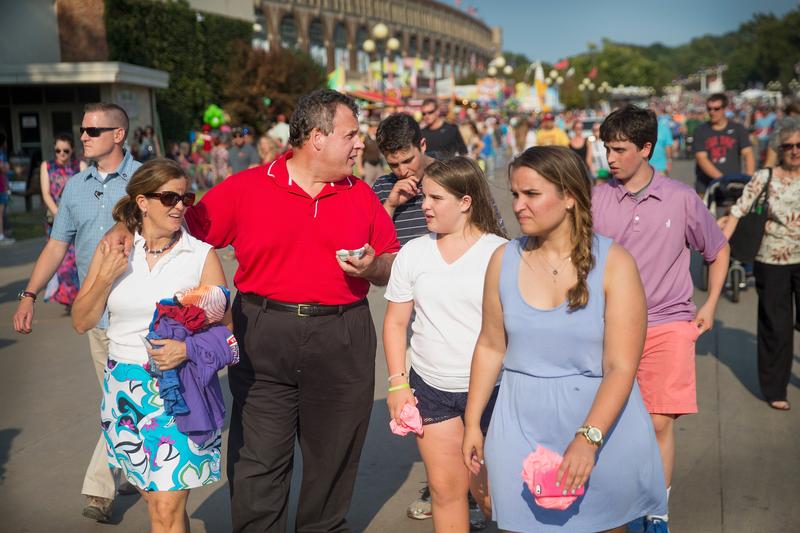 Gov. Chris Christie walks with his family (and a New Jersey state trooper) while campaigning at the Iowa State Fair last August.