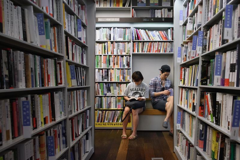 Readers browse the shelves of a Seoul bookstore.