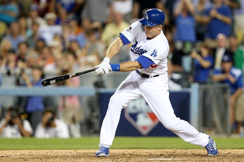 Chase Utley #26 of the Los Angeles Dodgers hits a single in the seventh inning against the New York Mets in game two of the National League Division Series at Dodger Stadium on October 10, 2015 in Lo